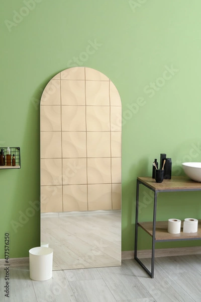 Fototapeta Mirror near green wall in bathroom