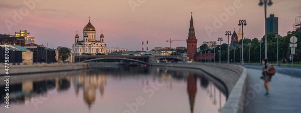 Fototapeta Dawn over Moscow and the river, beautiful city landscape. View of the Cathedral of Christ the Savior, Banner format