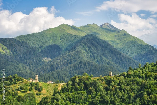 Fototapeta Ushguli village with rock tower houses in Svaneti, Georgia with a view of Greater Caucasus mountains. These are typical Svaneti defensive tower houses found throughout the village