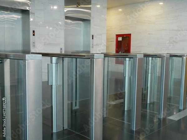 Obraz sliding barrier security system in office.	
