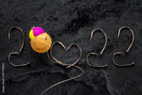 Fototapeta New Year 2022. Fishing hooks and boilie rig