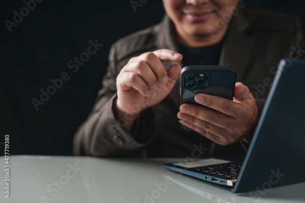 Fototapeta Asian man using computer. Businessman showing emotions during work. Technology of the world in the 5G. Working during the covid19. man working on the internet.