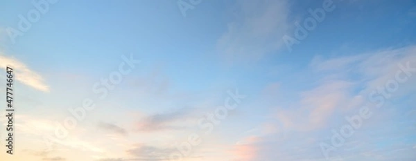 Obraz Clear blue sky with glowing pink and golden clouds after the storm. Dramatic sunset cloudscape. Concept art, meteorology, heaven, hope, peace. Graphic resources, picturesque panoramic scenery