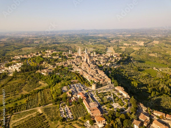 Fototapeta Aerial/Drone panorama of San Gimignano in the tuscany and its vineyards and olive trees, Tuscany Italy	