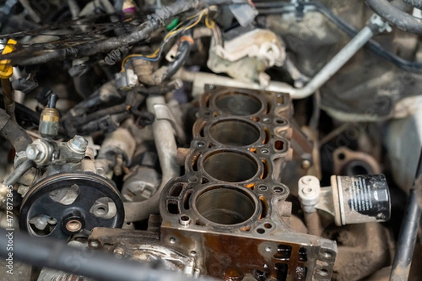Fototapeta Checking and repairing an internal combustion engine in an auto repair shop.