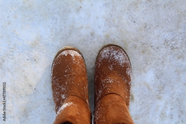 Obraz close-up of warm boots, ugg boots in the snow
