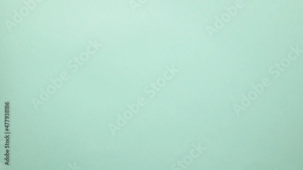 Fototapeta Smooth flat vintage paper bag pale texture in light blue color on table background.