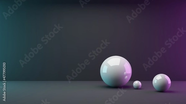 Fototapeta 3D rendering of three different sized shiny white spheres in the front right image area, which are illuminated turquoise, pink and white from three directions in front of a black background
