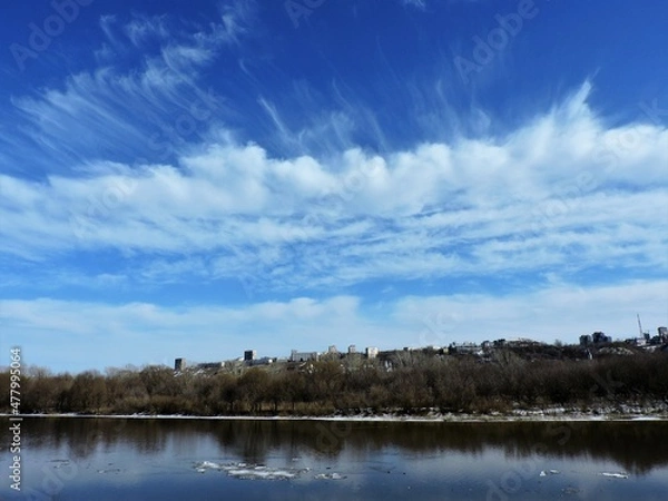 Obraz clouds over the spring  river