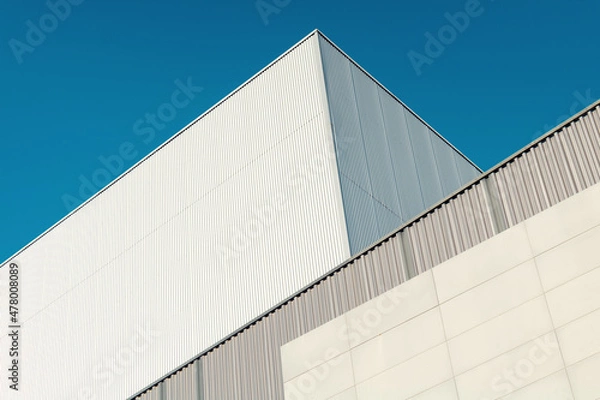 Obraz Abstract Modern architecture. Close up of a warehouse in a industrial park.