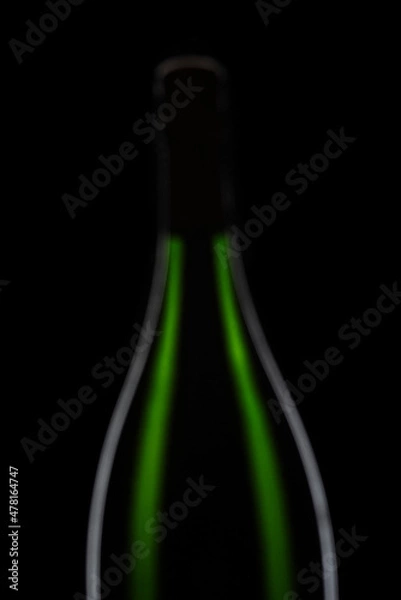 Fototapeta Green Champagne bottle graphically presented on black background