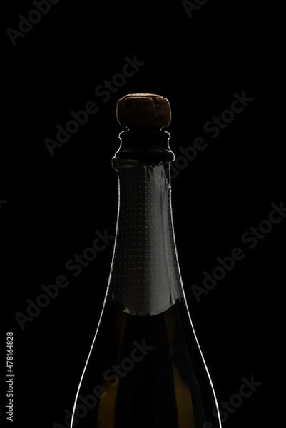 Obraz Champagne bottle with kork on black surface