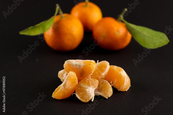 Obraz tangerine on black background