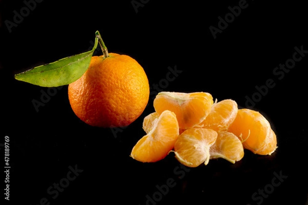 Obraz tangerines on black background