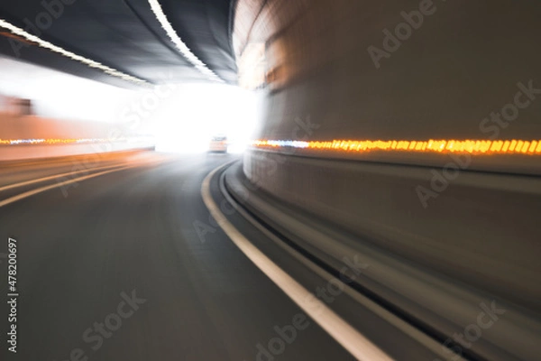 Fototapeta All in motion, travel to the end of the tunnel, and at the end this blinding light