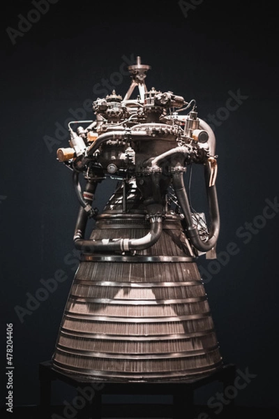 Fototapeta Spaceship rocket boosters close up and isolated against a black background