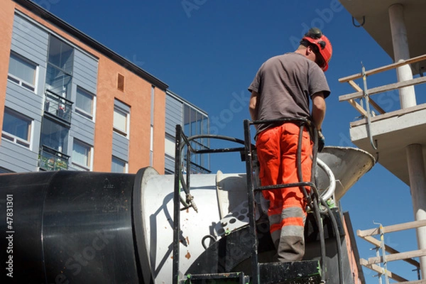 Obraz Concrete mixer truck operator is checking equipments