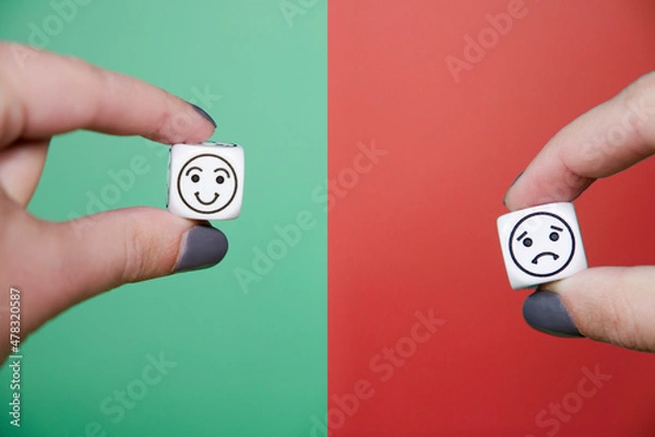 Fototapeta smiley face on green background and sad face on red background