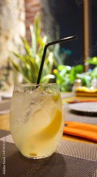Obraz cocktail with lemon on the table in the cafe in the bar refreshing drink