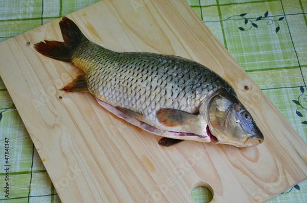 Fototapeta Fresh raw fish on the table