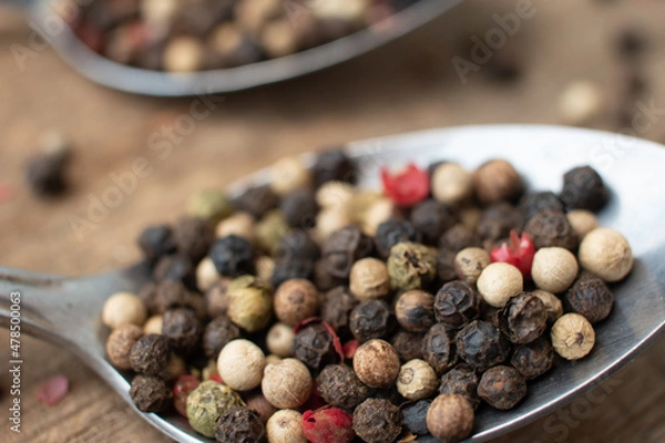 Obraz Various colored pepercorns on a dark background