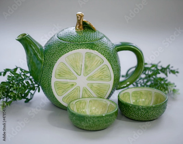 Fototapeta Teapot lime green. Handmade ceramic tea set