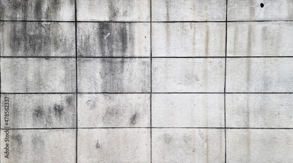 Fototapeta background of weathered concrete block wall. grey grungy and stained outdoor wall background. old grey brick wall.