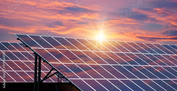 Fototapeta Photo collage of sunset and solar panel, photovoltaic, alternative electricity source - concept of sustainable resources