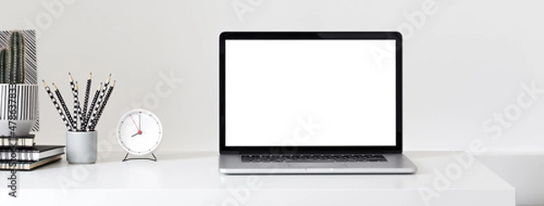 Fototapeta Laptop with blank screen on a table.	
