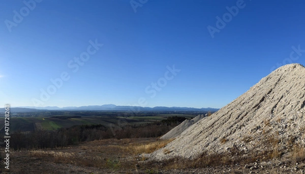 Obraz Dump of a chalkmine in front of the mountains