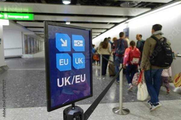Fototapeta View of a Generic UK/EU Lane Sign as Air Travellers Proceed to Passport Control at a British Airport 