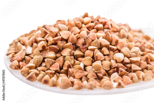 Fototapeta Buckwheat grains in spoon