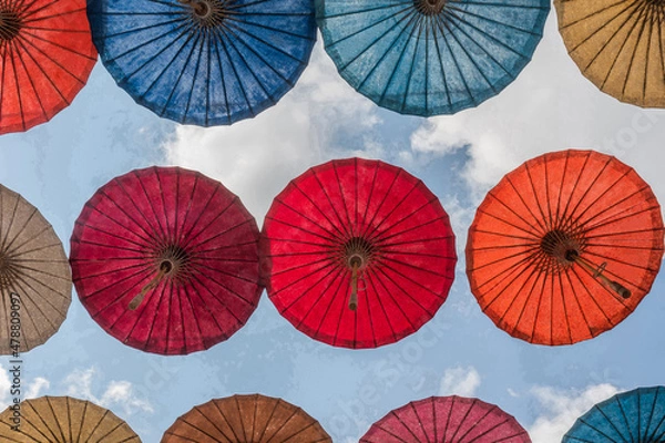 Obraz Paper Umbrella alley with blue sky in the background.