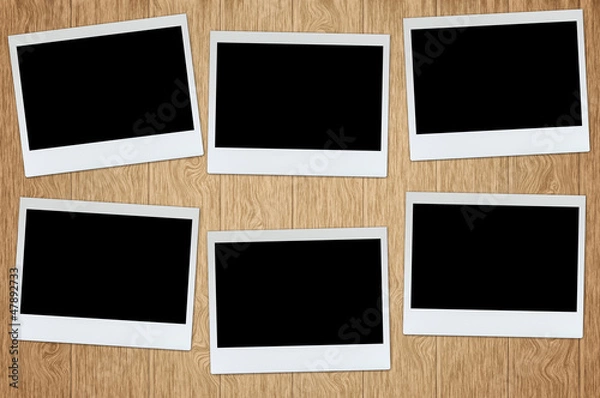 Fototapeta photo frame on wood plank background with clipping path