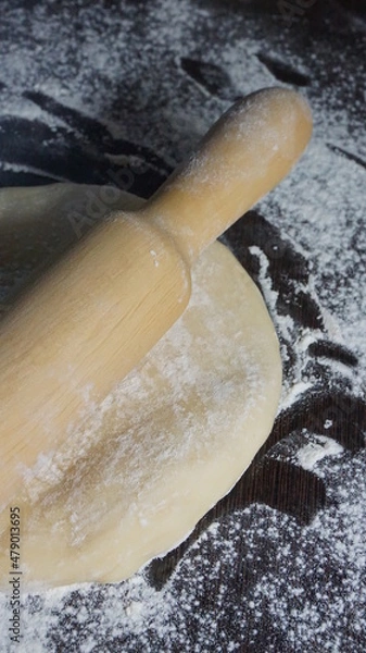 Fototapeta cooking process, modeling, recipe, dough, roll out with a wooden rolling pin, flour