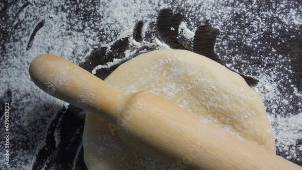 Obraz cooking process, modeling, recipe, dough, roll out with a wooden rolling pin, flour