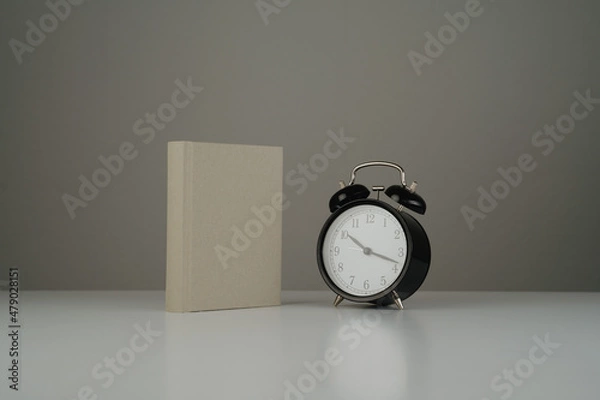 Fototapeta Empty book and black clock