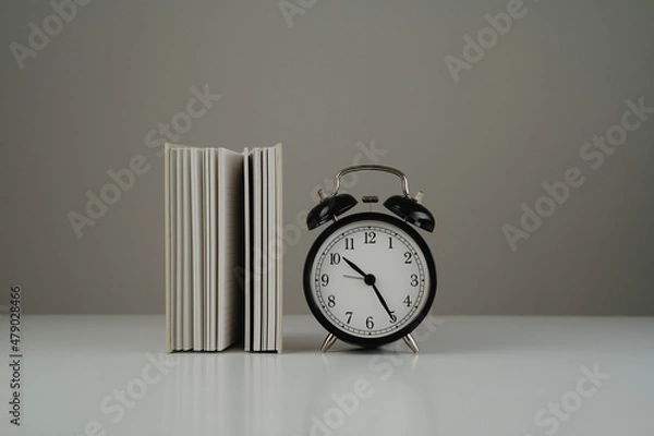 Fototapeta Empty book and black clock