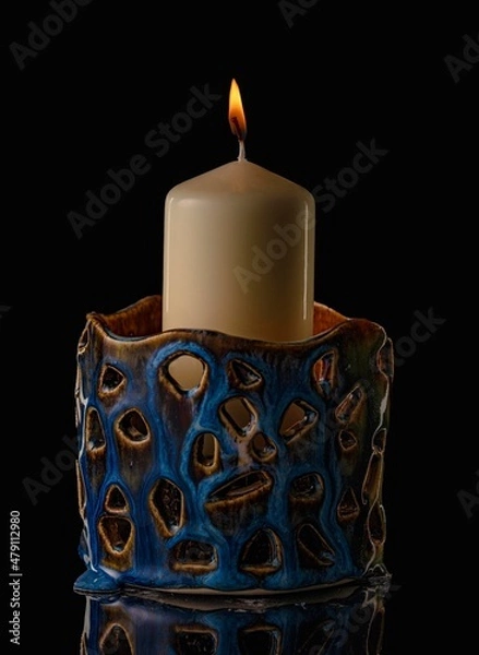 Obraz ceramic candlestick on a dark background
