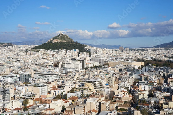Fototapeta Cityscape of Athens, withe the Greek parliament and the Lycabettus hill located in the background. Photo taken from the Acropolis walls.