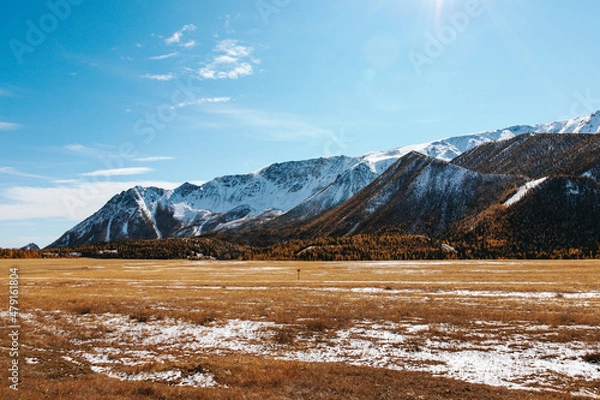 Fototapeta High cliffs in the mountains with snow on the peaks in Altai