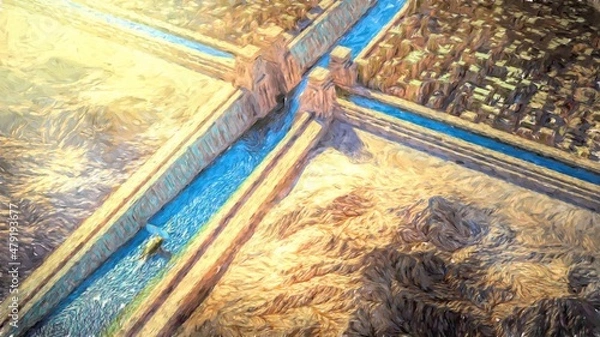 Fototapeta Bird's eye view of an ancient city in the middle of a rocky desert with a channel in the middle