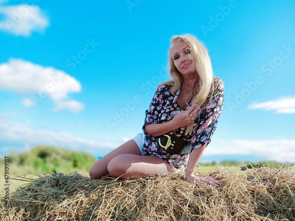 Obraz girl on the manger in summer