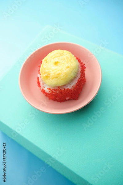 Fototapeta sushi rolls on a color background, minimalism