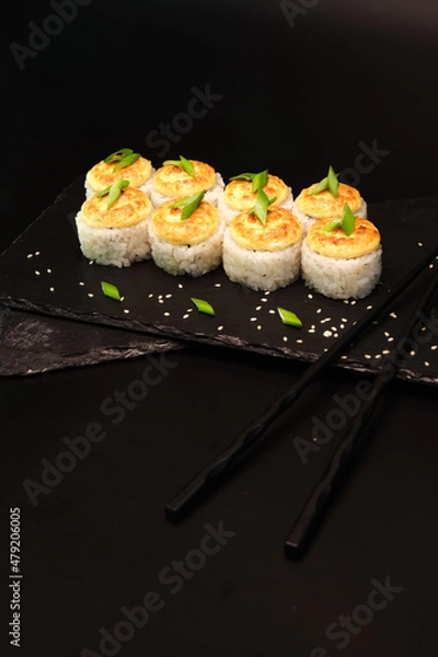 Fototapeta sushi rolls on a color background, minimalism