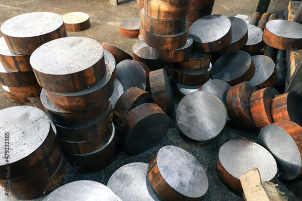 Fototapeta Round steel rods sawn into identical blanks for further processing on machine tools. Close-up with selective focus. 