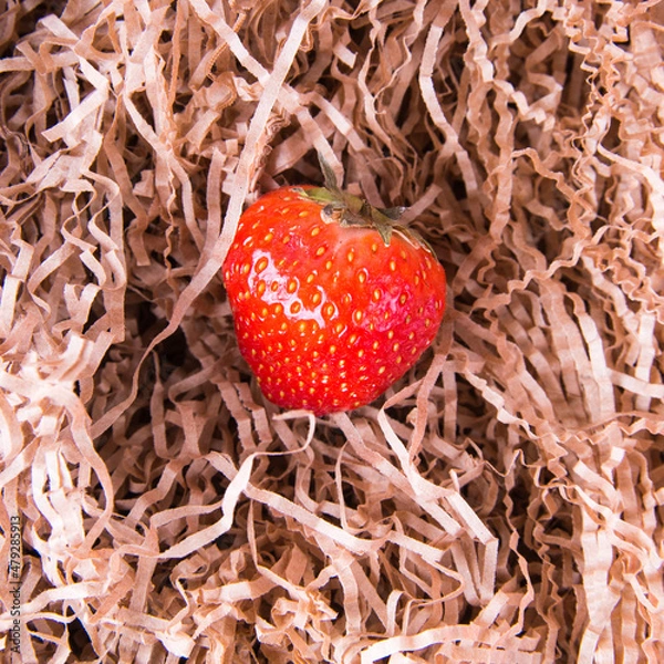 Obraz Strawberries on paper straws top view, copy space