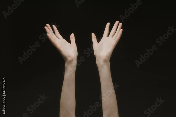 Fototapeta Praying hands to God in the dark. Woman hands reaching out to God or for help in barokko style
