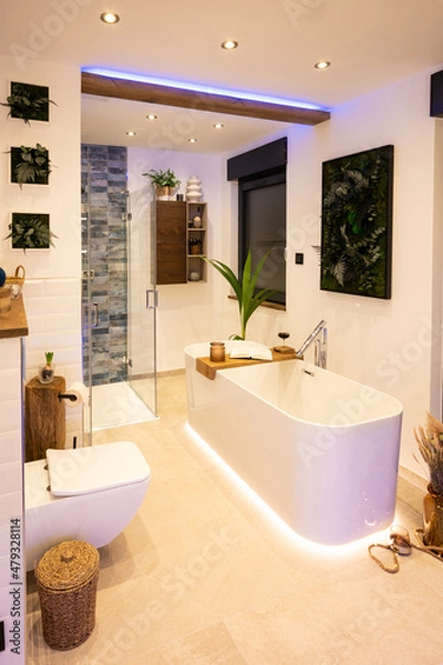 Fototapeta Modern bathroom with freestanding bathtub, modern taps and LED ambient lighting