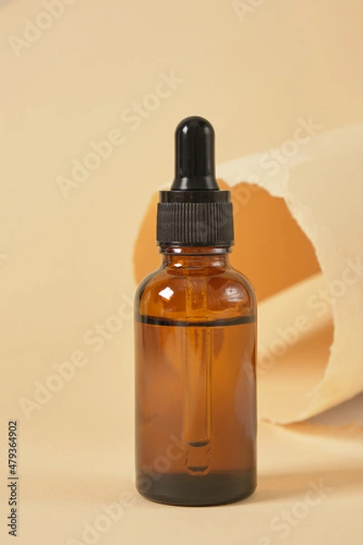 Obraz Dropper Bottle with clipping path on a beige background